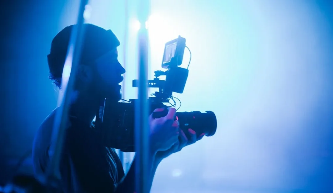 A man holding a camera. Perhaps making WordPress videos for YouTube or a website. Probably not.