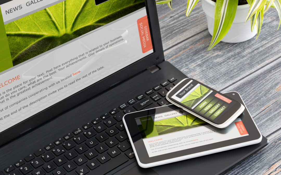 Responsive web design on mobile devices phone, laptop and tablet pc. Adobe licensed image.
